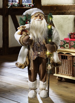 Weihnachtsmann mit beleuchtetem Wanderstock