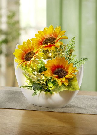 Beleuchtetes Sonnenblumen-Arrangement