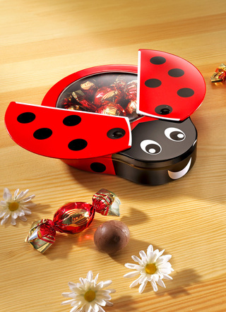 - Milchschokoladen-Geschenkdose Glückskäfer, in Farbe