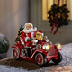 - Weihnachtsmann mit Oldtimer aus Polyresin, in Farbe BUNT