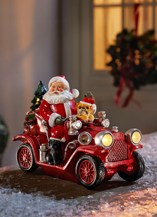 - Weihnachtsmann mit Oldtimer aus Polyresin, in Farbe BUNT