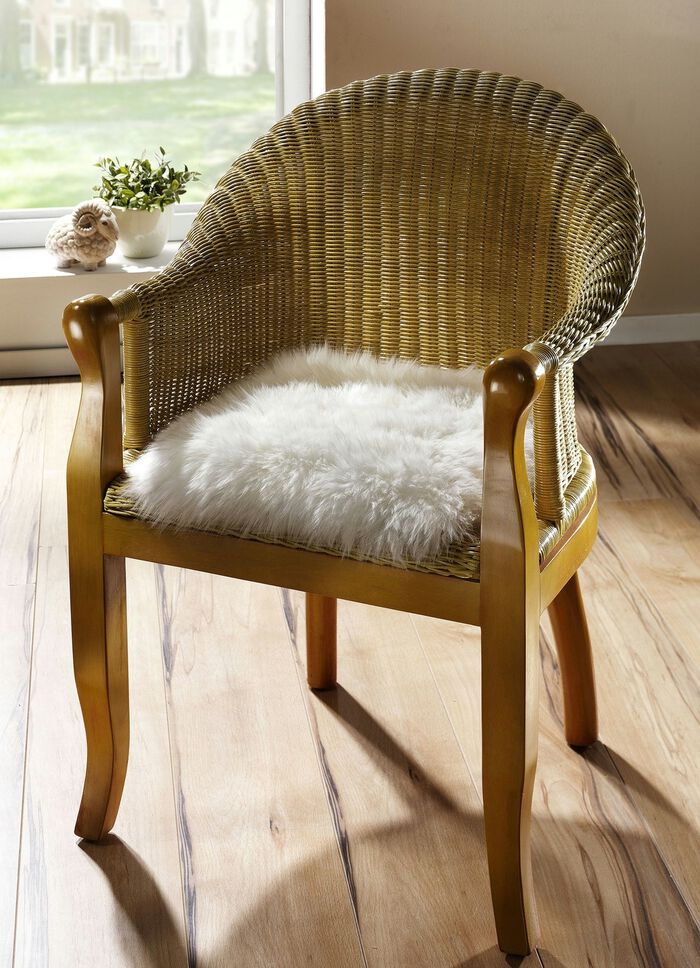 Merino-Lammfell-Sitzauflage in Tierform 